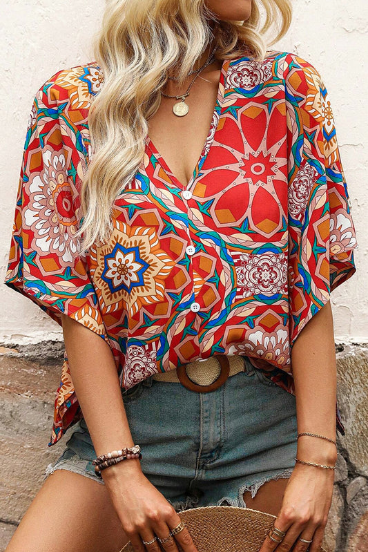Rode blouse met v-hals en een bloemenprint - PrizQ