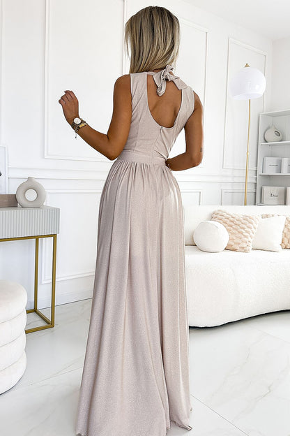 Justine Midnight Glamour Maxi Jurk meerdere kleuren met glitter, draaiend om de strik op de rug te tonen.