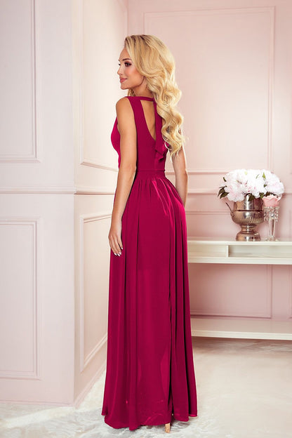 Justine Midnight Glamour Maxi Jurk meerdere kleuren met glitter, draaiend om de strik op de rug te tonen.