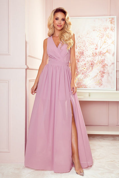 Justine Midnight Glamour Maxi Jurk meerdere kleuren met glitter, draaiend om de strik op de rug te tonen.