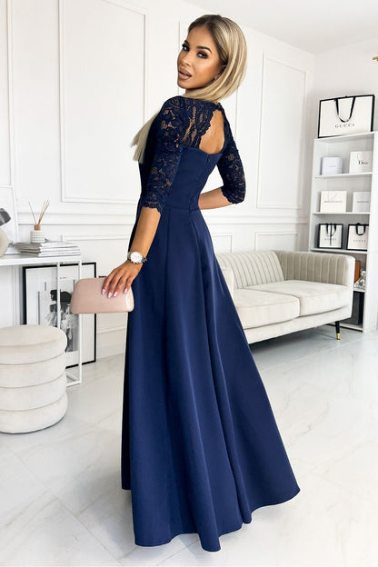 Model draagt ivoren Numoco jurk op bruiloft – Elegante outfit voor speciale gelegenheden